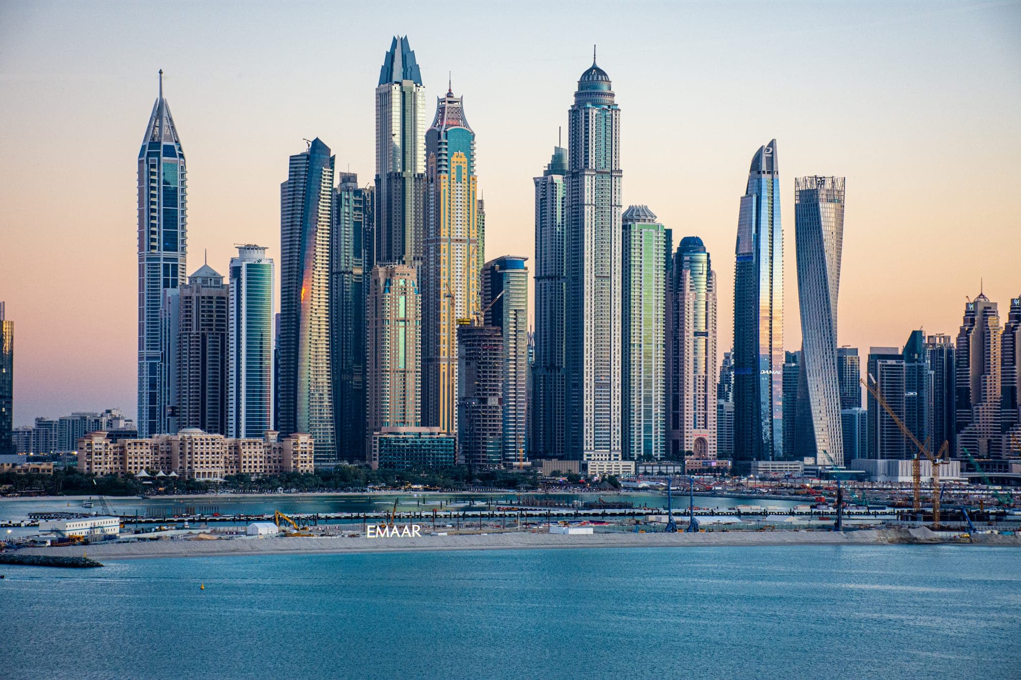 Dubai Marina towers reflected in the water at dusk